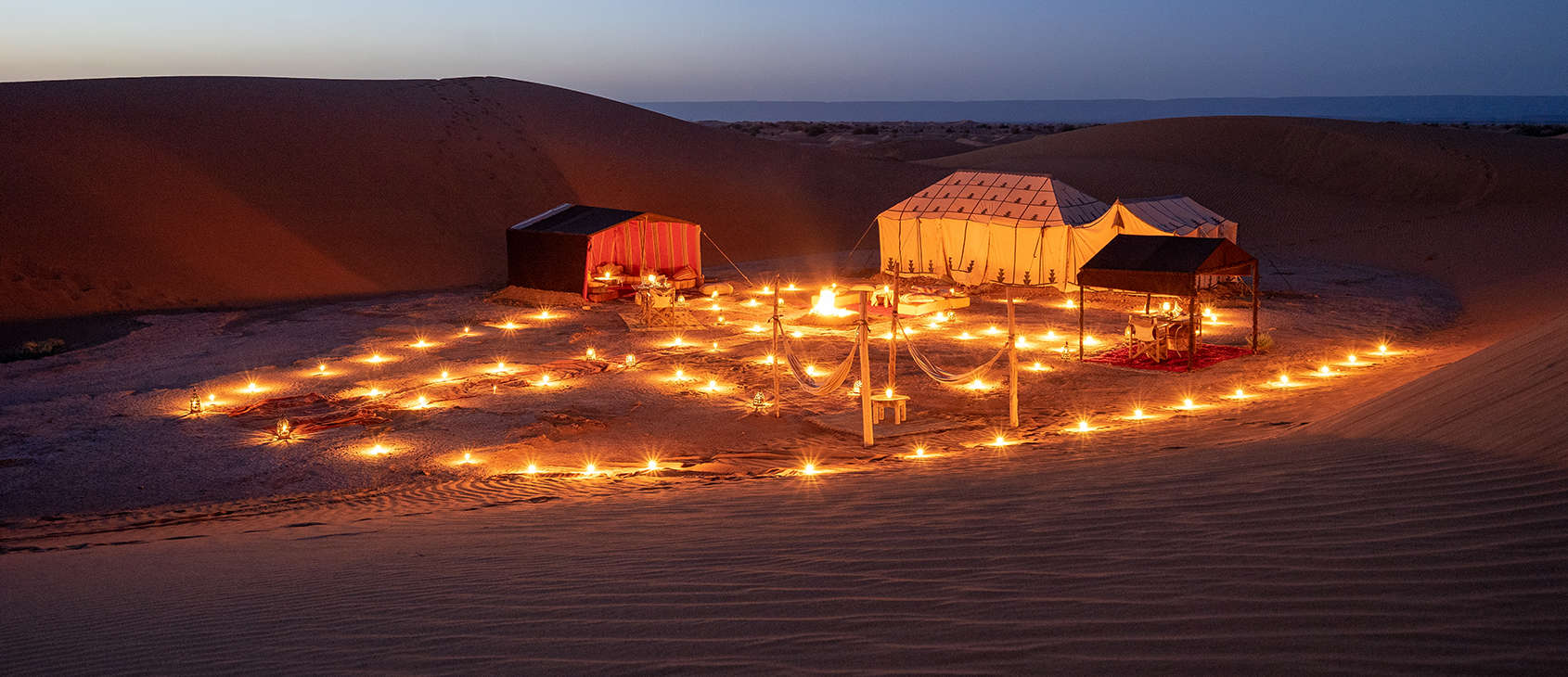 Erg Chigaga Luxury Desert Camp Morocco, Private Nomadic Camp at dusk
